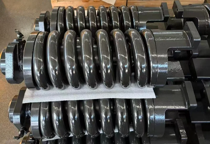 Customizable heavy-duty cast steel tensioner assemblies for construction machinery parts