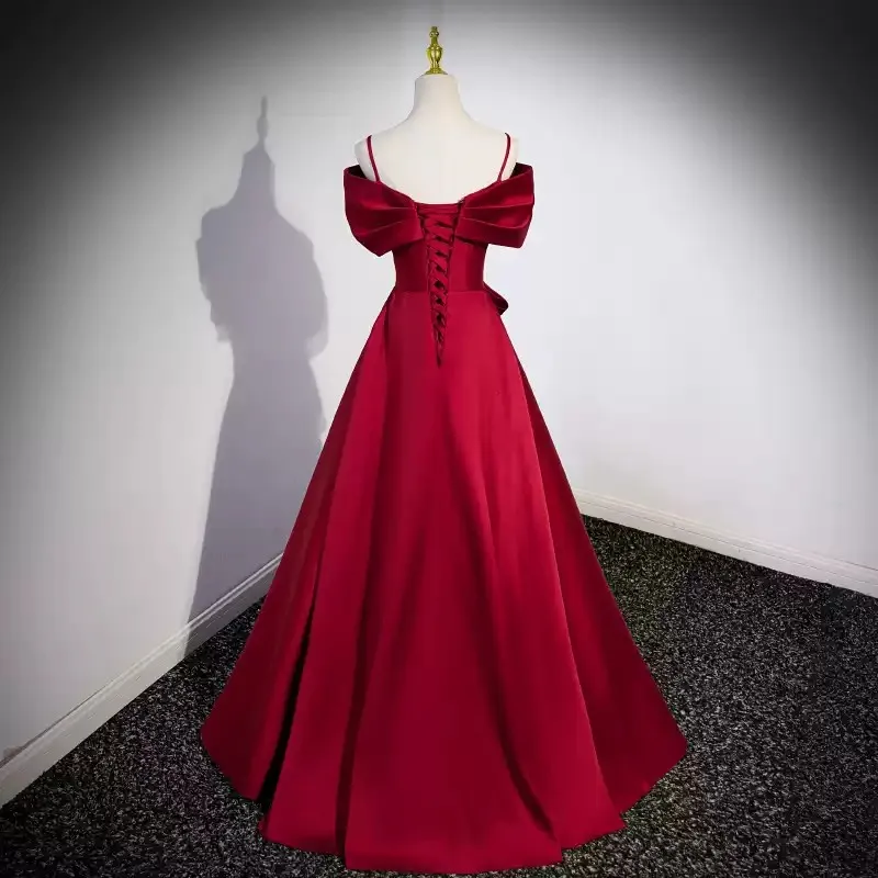 

Stunning Burgundy Off - the - Shoulder Satin Prom Dress with Straps and Large Bow Detail