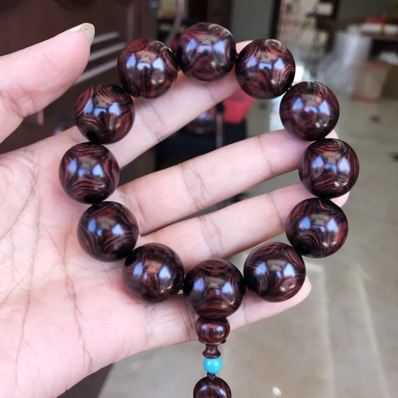 

Authentic Hainan Huanghuali Male Sea Yellow Wild Purple Oil Pear 20mm -to-Eye Grimace Wooden Bracelet