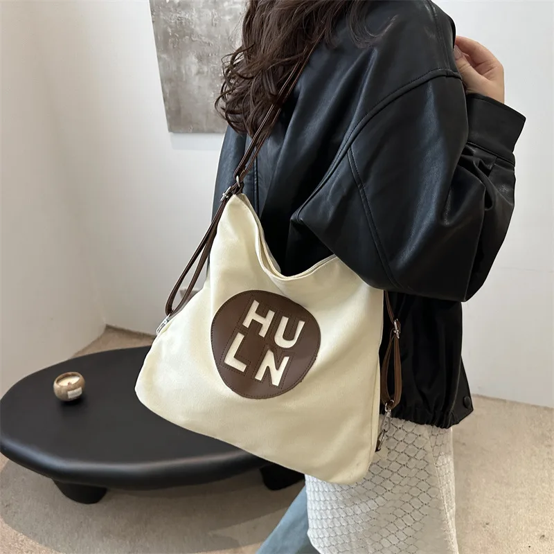 

2024 Solid Color Multifunctional Printed Letter Large Capacity Lightweight Travel Texture Crossbody Bag Women's Shoulder Bag