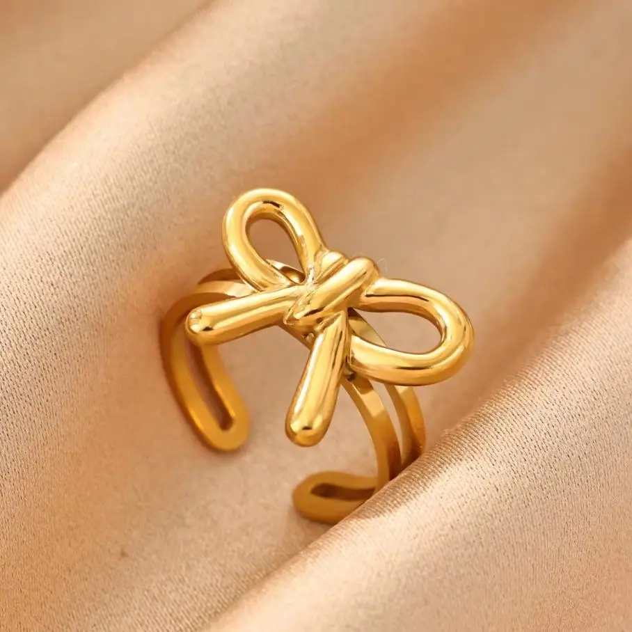 Modische Schleifenringe für Damen, goldfarben, aus Edelstahl, verstellbar, ideal als Geschenk für Hochzeiten oder Weihnachten.