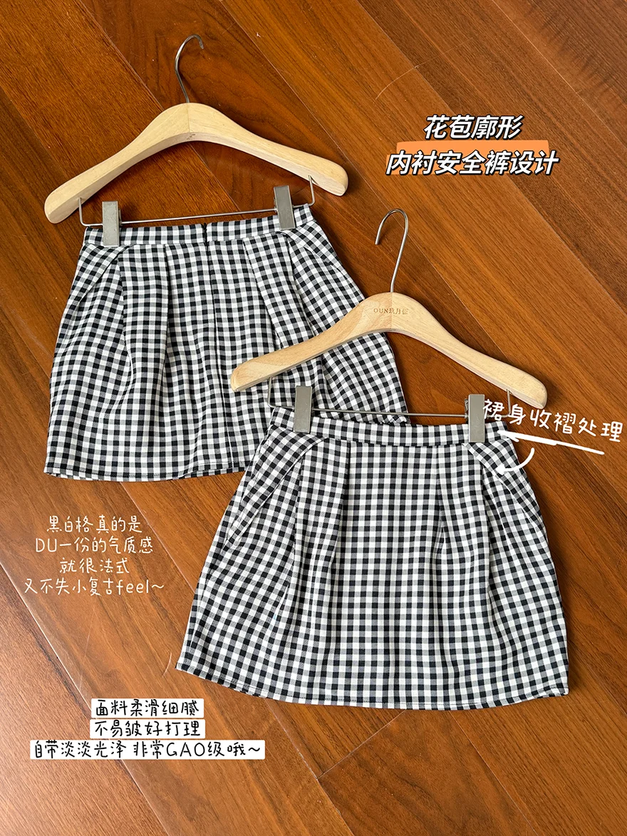 กระโปรงสั้นทรงเอเอวสูง กระโปรงสั้นลายตารางสีดำและสีขาวแฟชั่นอเนกประสงค์ของผู้หญิงกระโปรงสั้นกระโปรงดอกไม้