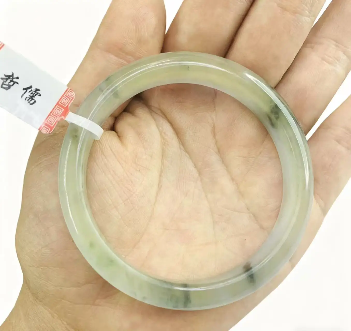 

One on one real shooting of a large blue color 58.7mm jade bracelet