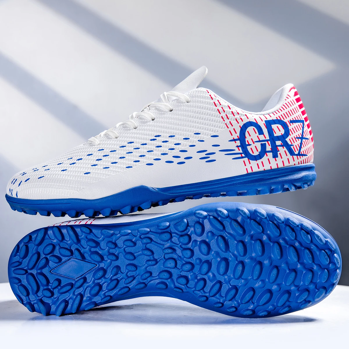 

Football shoes with TF studs for turf and FG long studs, suitable for both men and women, designed for slip resistance. sneakers