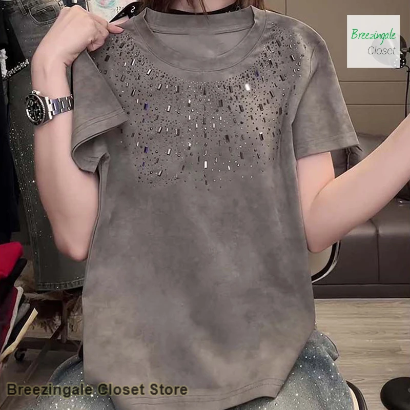 

Korean style heavy industry light luxury short-sleeved T-shirt female summer slim loose round neck temperament rhinestone top.