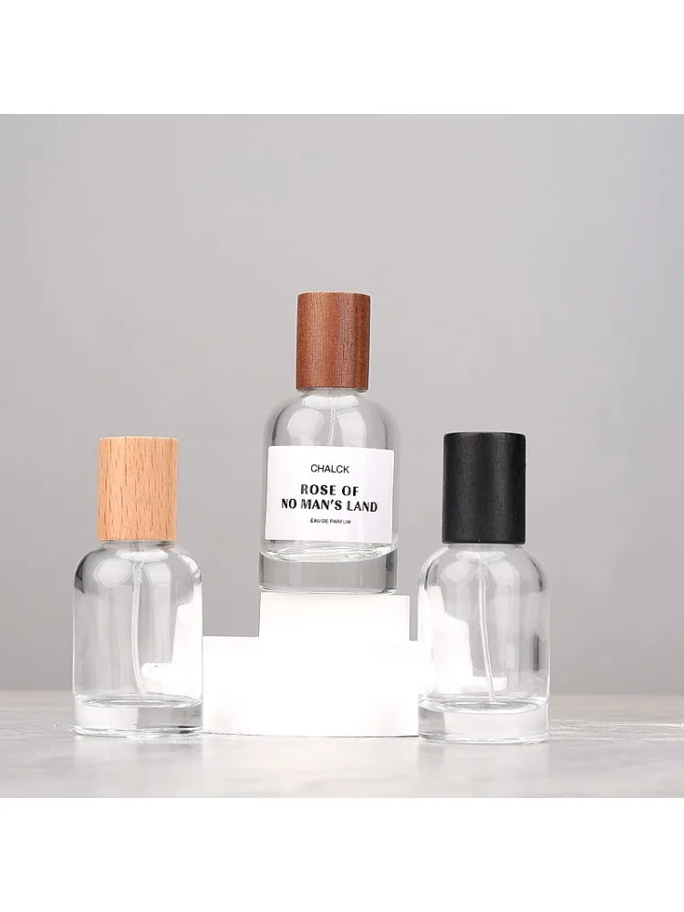 Bouteille de parfum ronde en verre de 50ml, vaporisateur transparent, bouteille d'emballage, atomiseur rechargeable, récipient cosmétique de voyage de haute qualité