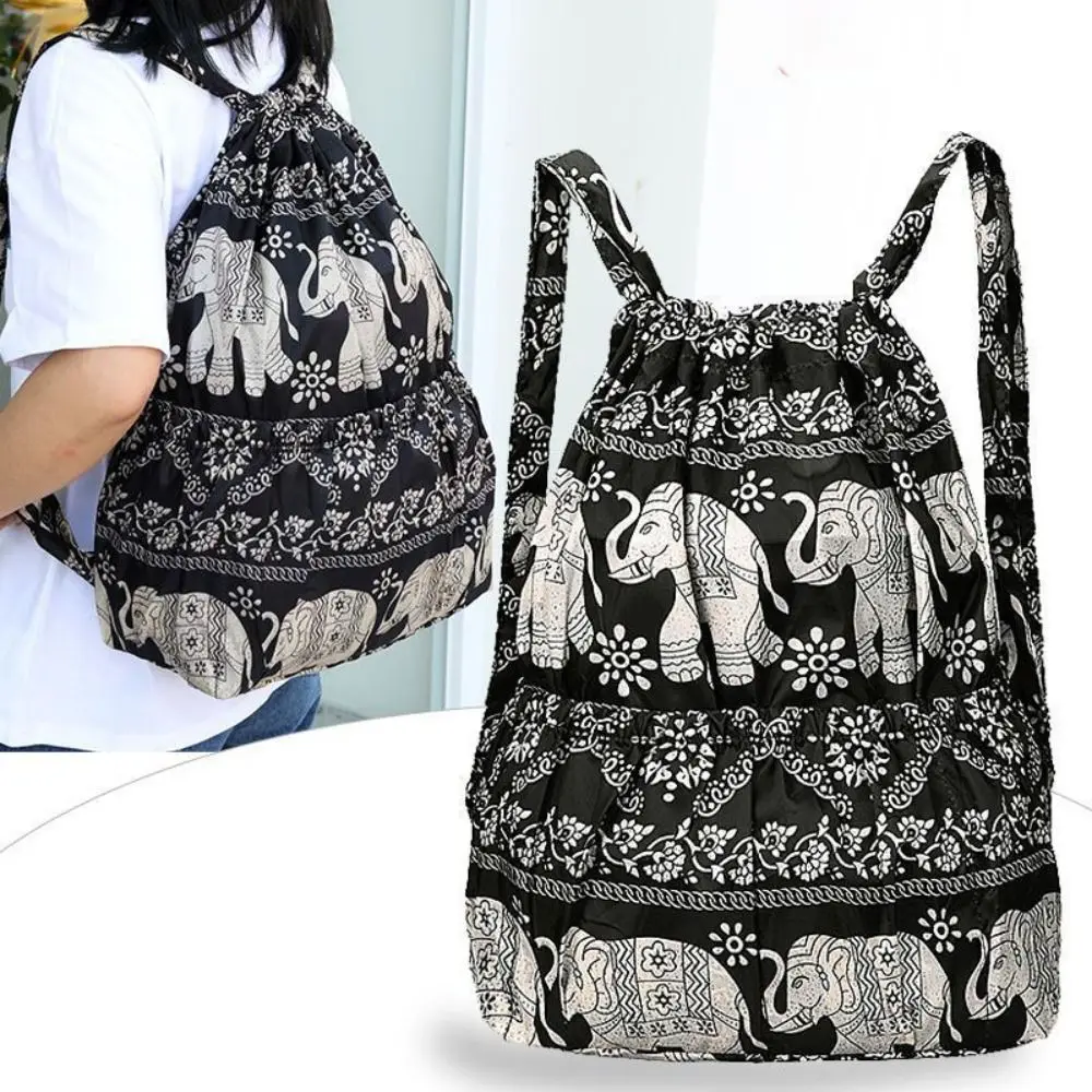 กระเป๋าหูรูดพิมพ์ลายดอกไม้กันน้ำความจุขนาดใหญ่กระเป๋าช้อปปิ้งแบบพกพาโพลีเอสเตอร์น้ำหนักเบากระเป๋าเป้สะพายหลังวัยรุ่นหญิง