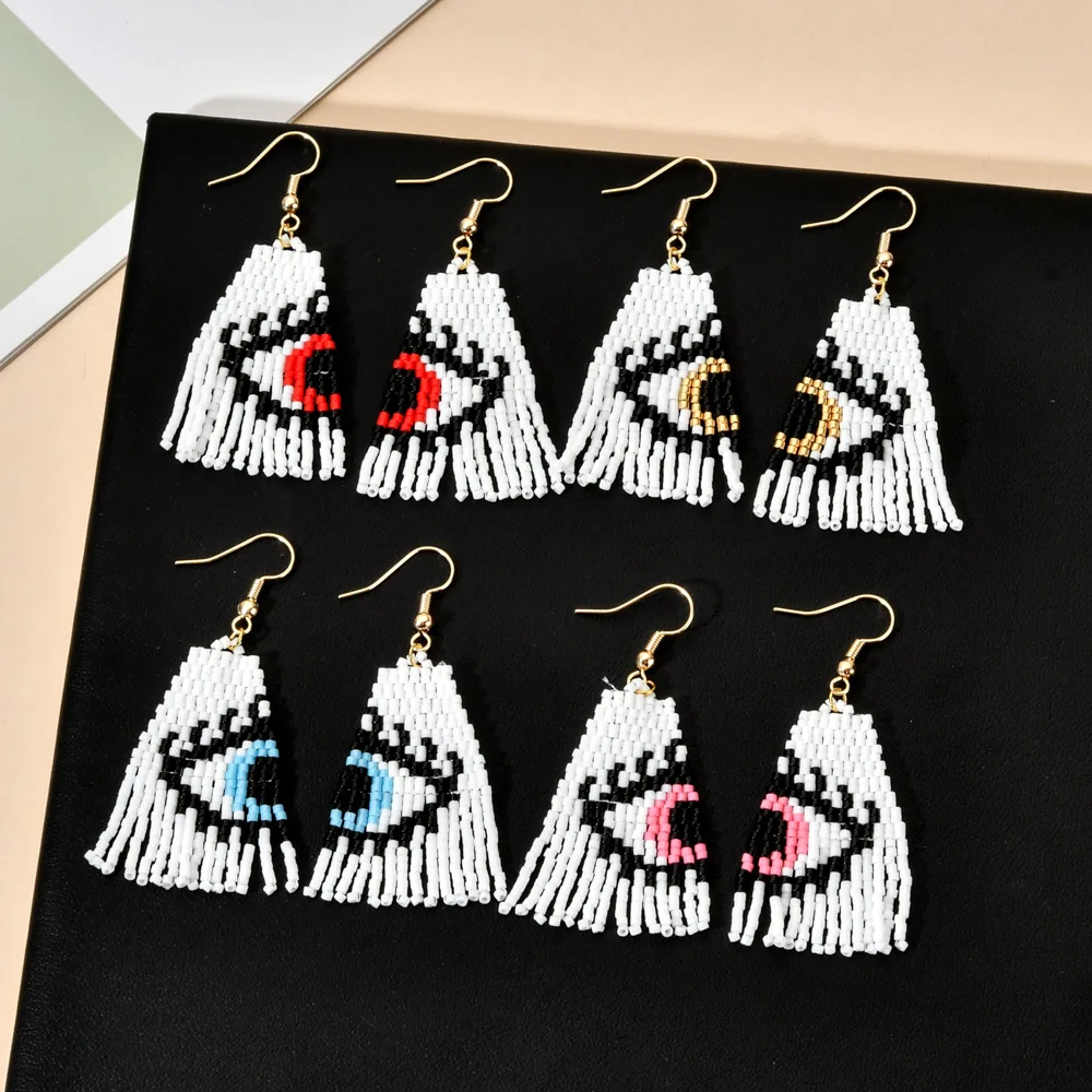 ZGMXR Rice bead earrings Tassels Devil's Eye symmetry Hand weaving Bohemia Alloy Woman Fashion Simple Creativity Beaded earrings