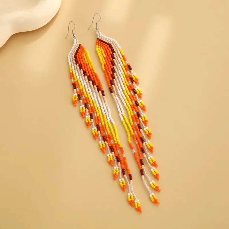 

Rice bead earrings Tassel Symmetry Heart Versatile Design Originality Hand knitting Bohemia Alloy Fashion Simple Beaded earrings