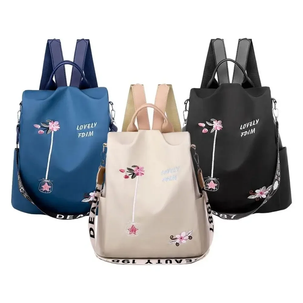 Close-up of floral embroidery on backpack