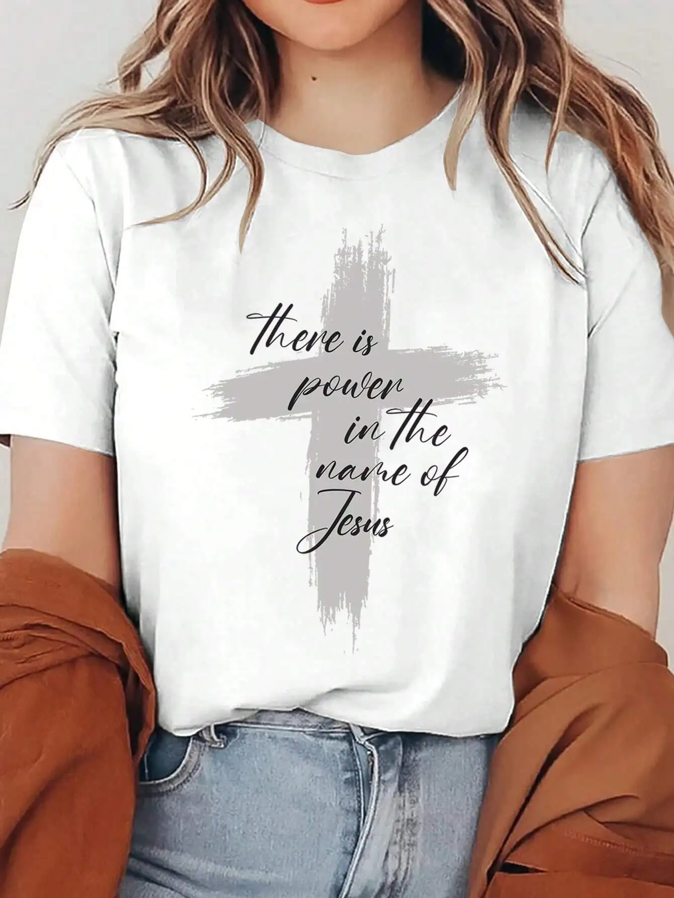 

Plus Size Faith Inspired Tee White Oversized Shirt With “There Is Power In The Name Of Jesus” Cross Graphic For Spiritual Style