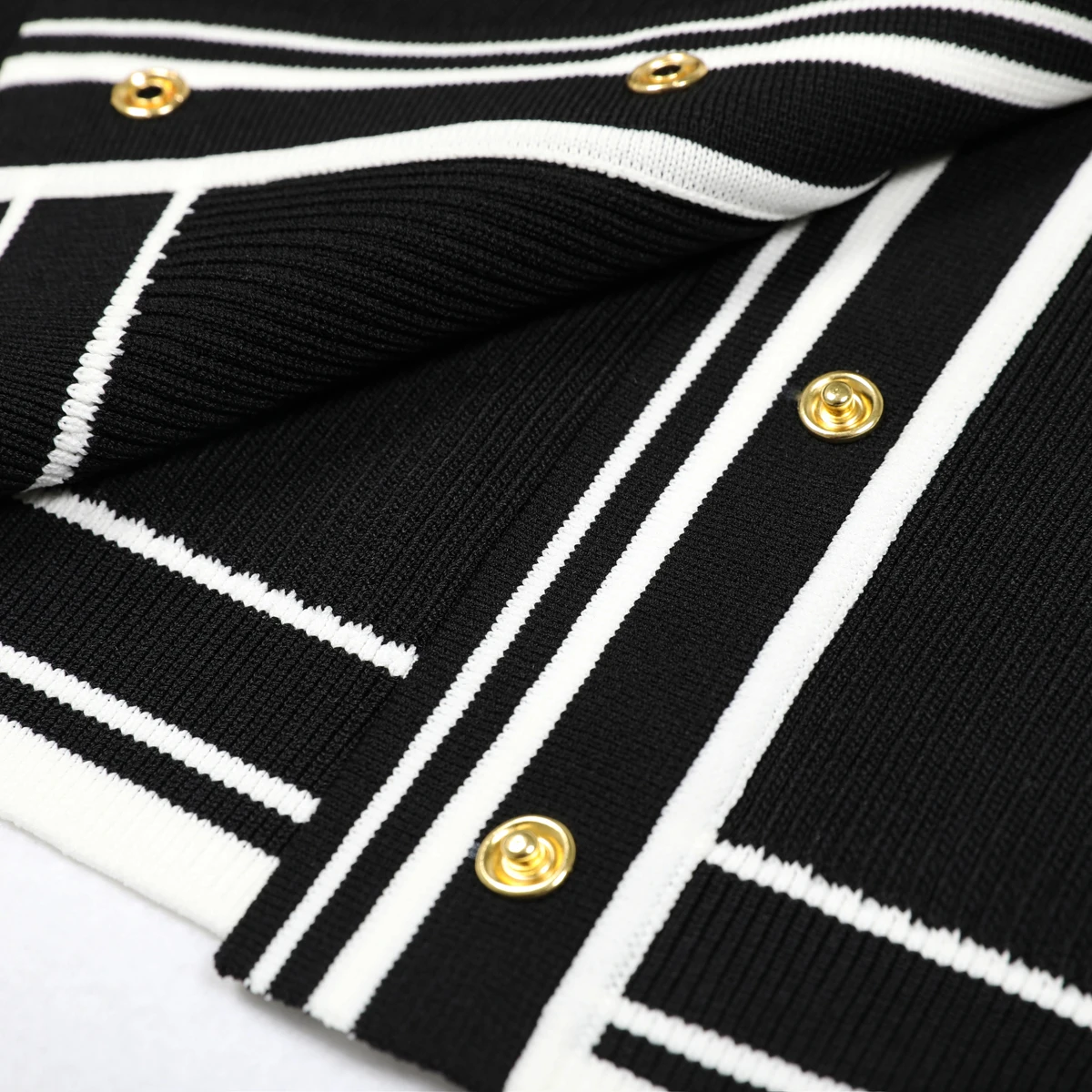 Primavera y otoño nueva moda viajero manga larga cuello empalme tira camisa de punto de las mujeres cárdigan versátil abrigo