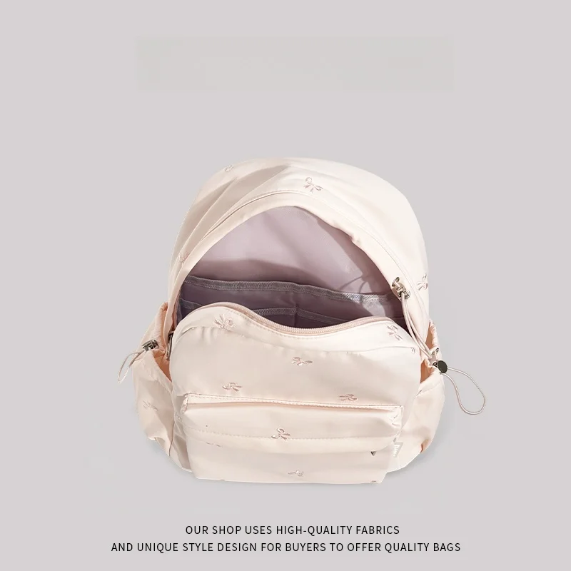 حقيبة مدرسية وردية اللون للفتيات جديدة 2025 المدرسة الثانوية بابا طبقة مزدوجة البوليستر المواد الداخلية سستة إغلاق استخدام الحرم الجامعي