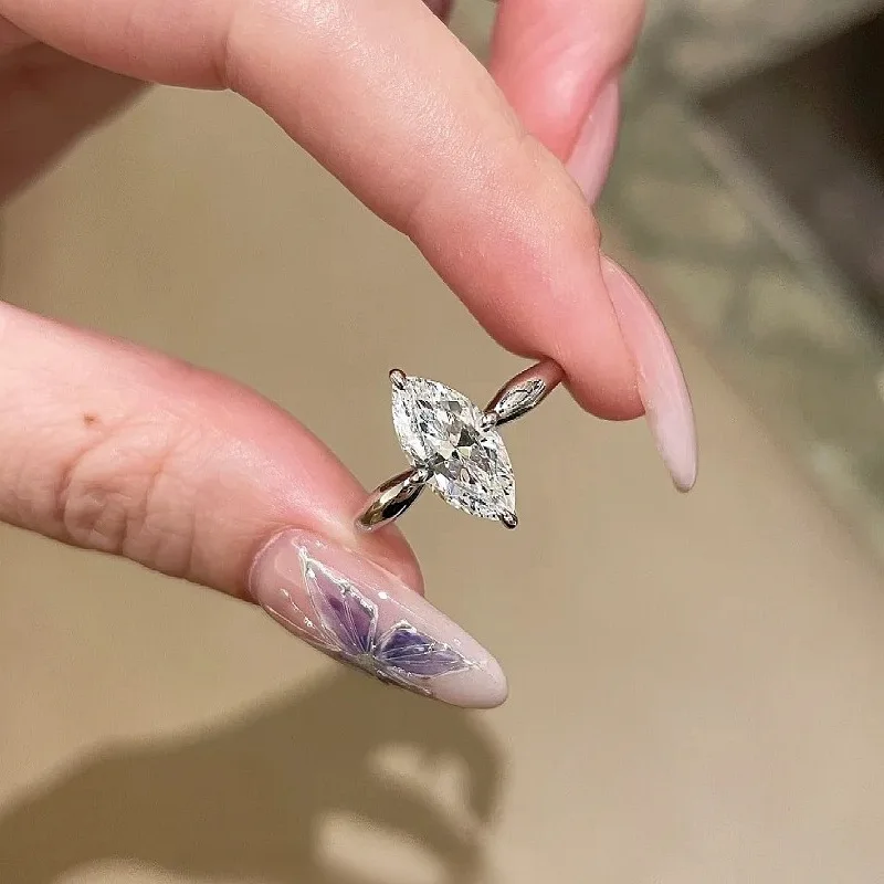 

Женское кольцо 2Ct Moissanite PT950 Platinum Marquise - яркий блеск, форма подчеркивает бриллиант, приличный романтический подарок