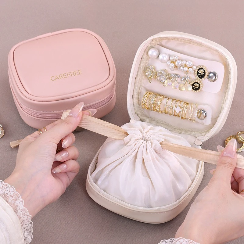 

PU Leather Jewelry Storage Bag- Drawstring Travel Case with Removable Earring Board & Ring Holder (Compact Waterproof Organizer)