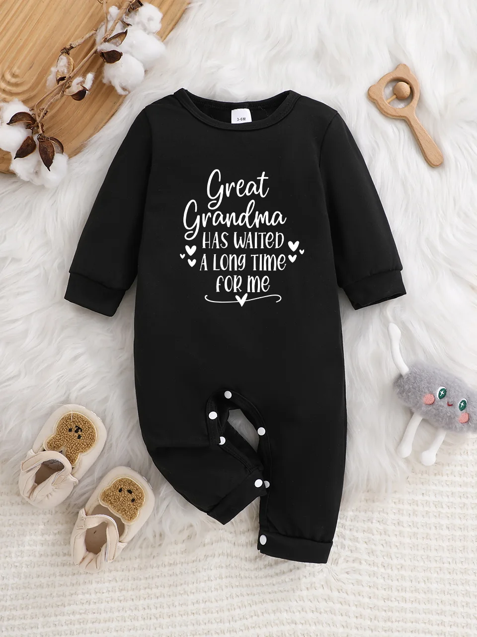 Baby long-sleeved bodysuit with fun letter prints, button design, easy care, suitable for new parents.
