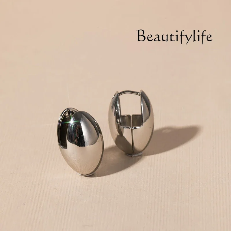 Geometric elliptical earrings three-dimensional stud earrings European and American simple atmosphere hollow light daily