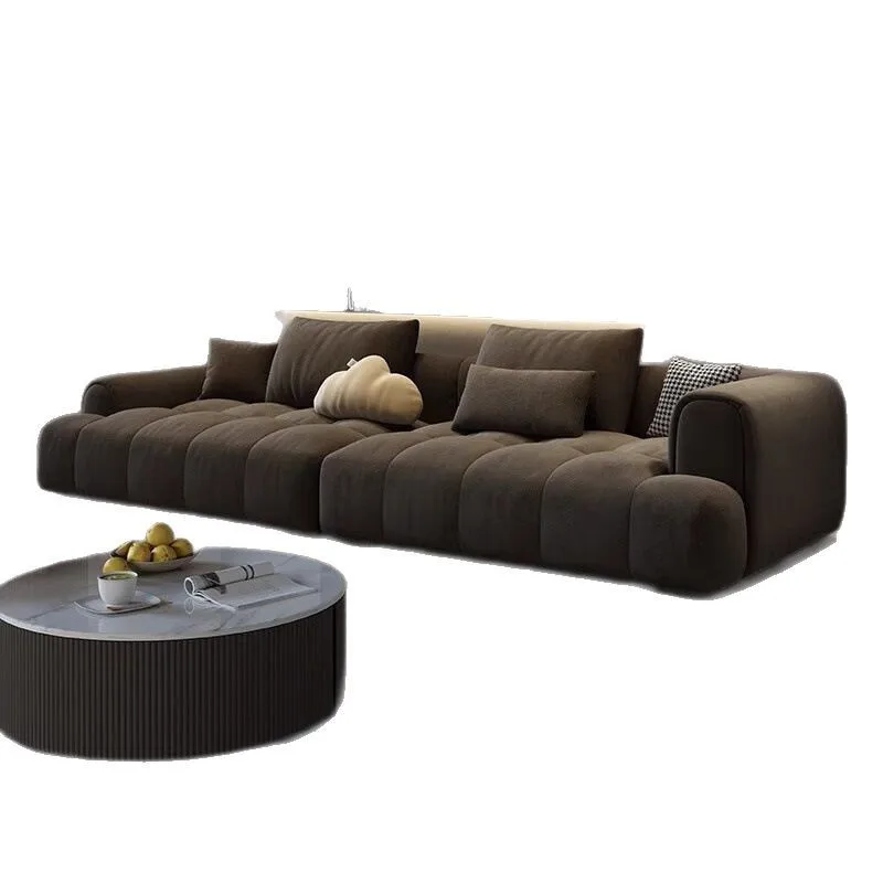 

The corner of the living room is decorated with a luxurious sofa and a cream style minimalist fabric sofa