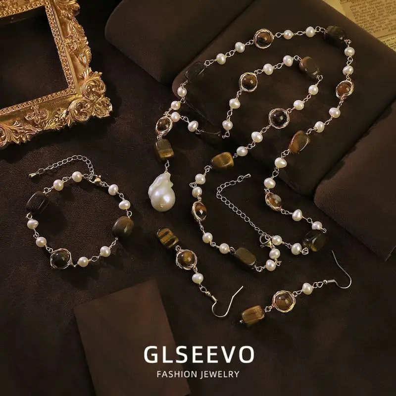 Design: A Set Of Three Pieces Including Earrings A Bracelet A Necklace All Featuring Natural Pearls And Tiger'S