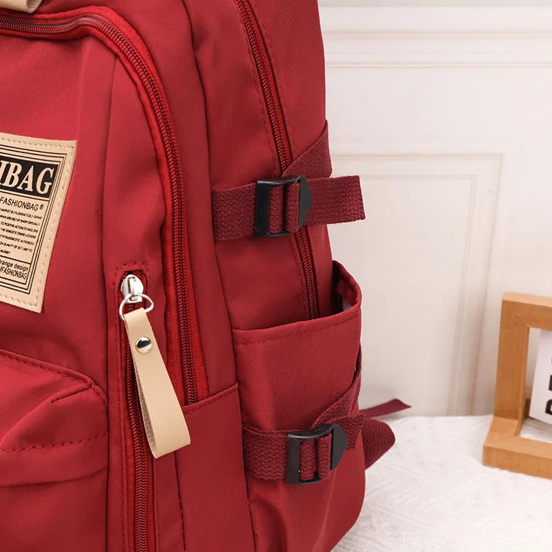 Multi-Pocket School Backpack, Casual Water Resistant Nylon Daypack, Large Capacity Travel Backpack with Label Detail