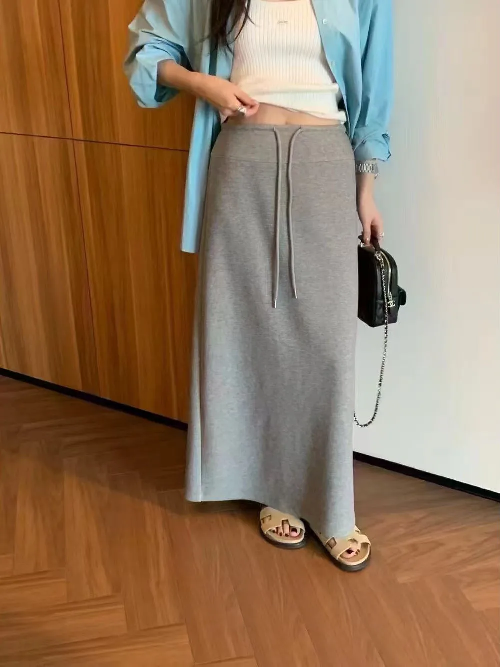 أوائل الخريف 2025 المرأة عالية الخصر مستقيم قطع تنورة الكورية Sle Dstring با سبليت عادية التخسيس تنورة طويلة