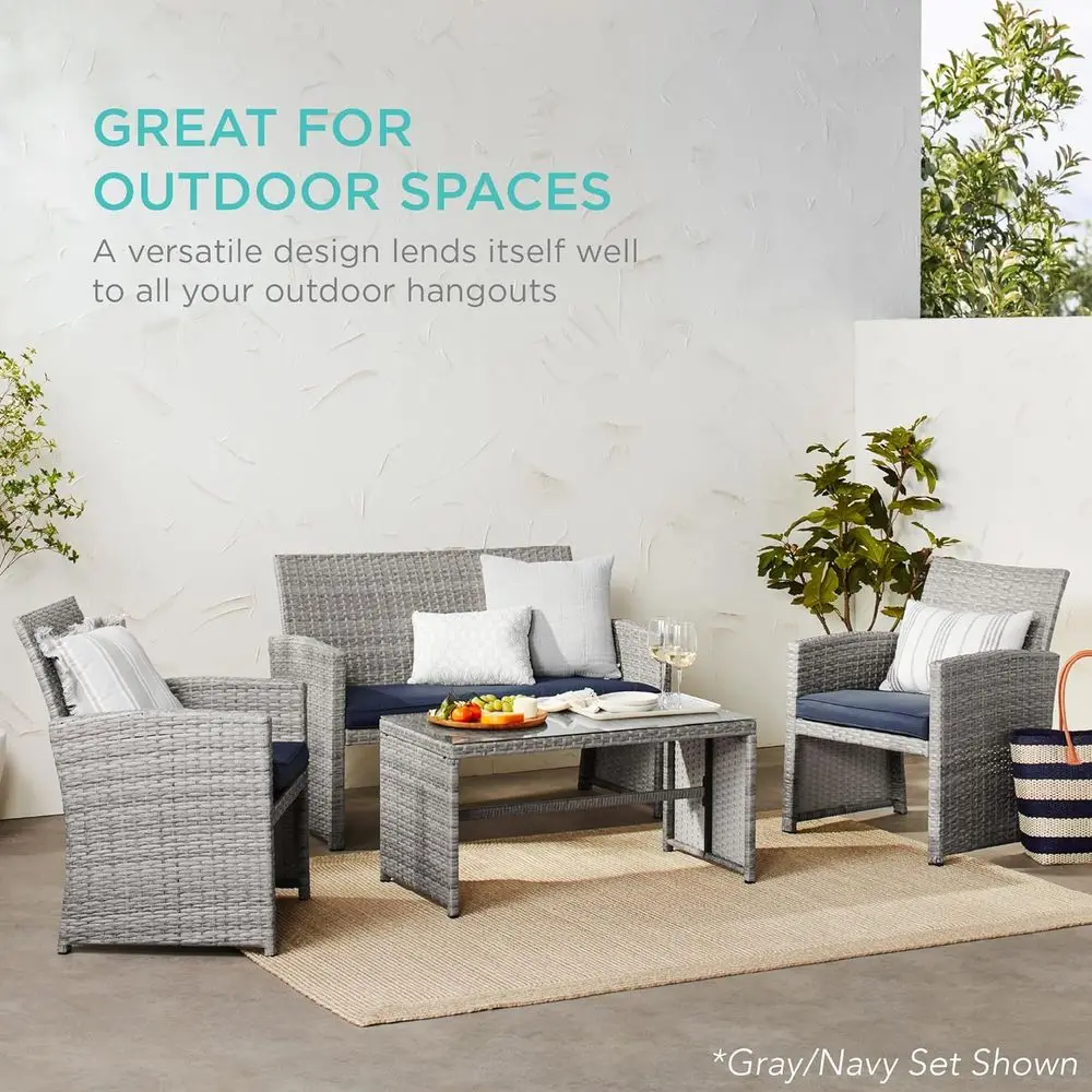 4-Piece Outdoor Wicker Patio Furniture Set with double sofa, two chairs, and glass top coffee table