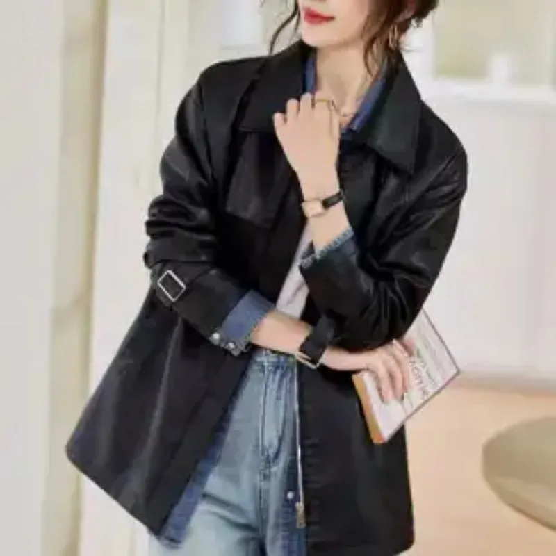 

Women's Black Faux Leather Turn Down Collar Drawstring Waist Mid Length Jacket with Pockets and Cuff Buckles