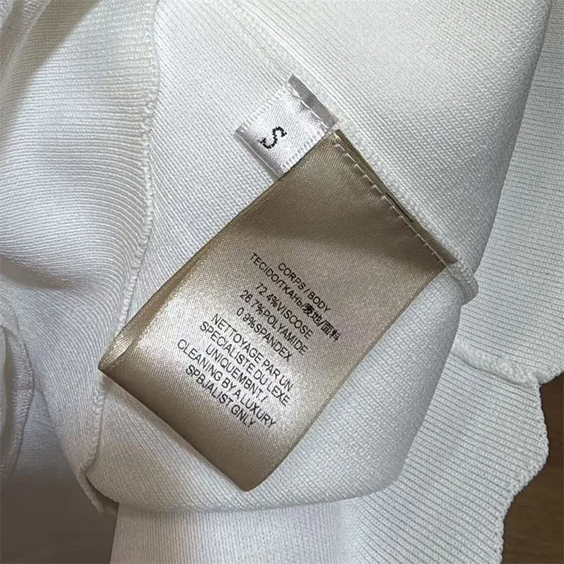 Immagine 7: Abito da donna nuovo in maglia elasticizzata, mini abito slim per l'autunno 2026, abito corto senza maniche con volant a strati, abito da festa scavato
