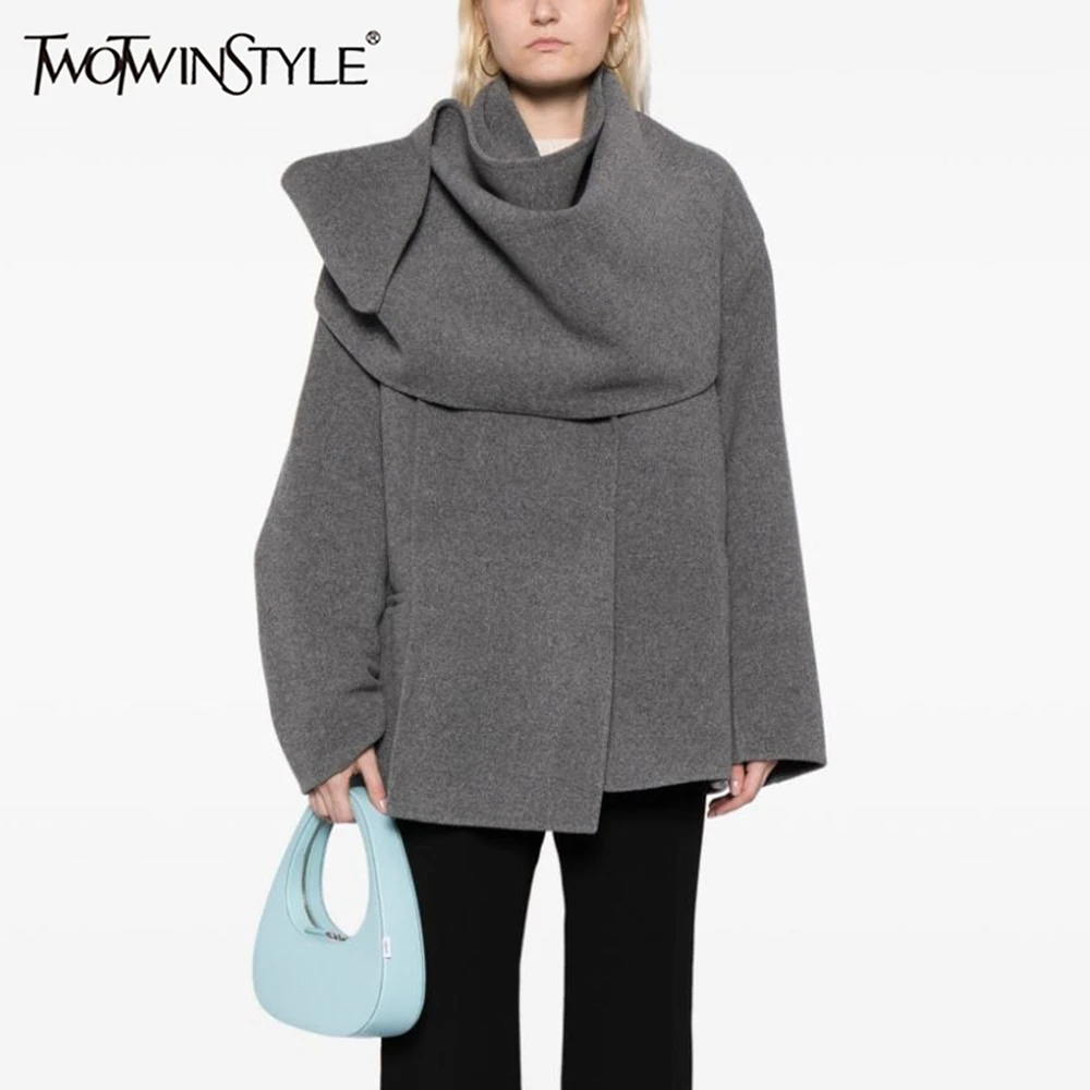 TWOTWINSTYLE Asymmetrical Patchwork Pocket Coat For Women Scarf Collar Long Sleeve Spliced Button Minimalist Coats Female New