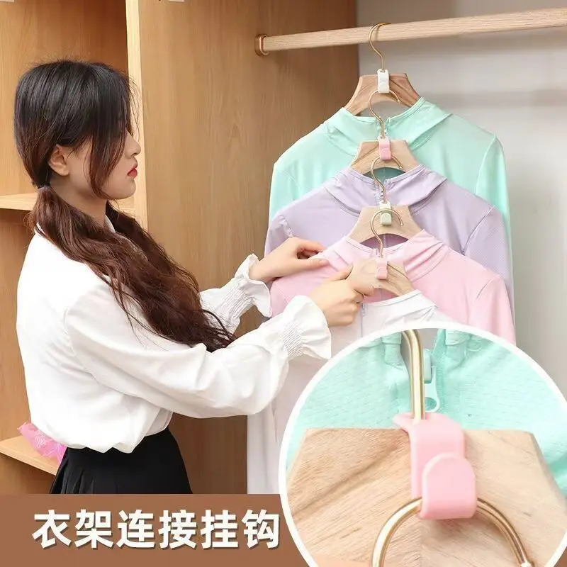 Reinforced plastic hanger featuring dual connection points, compact foldable design for efficient closet organization, stackable
