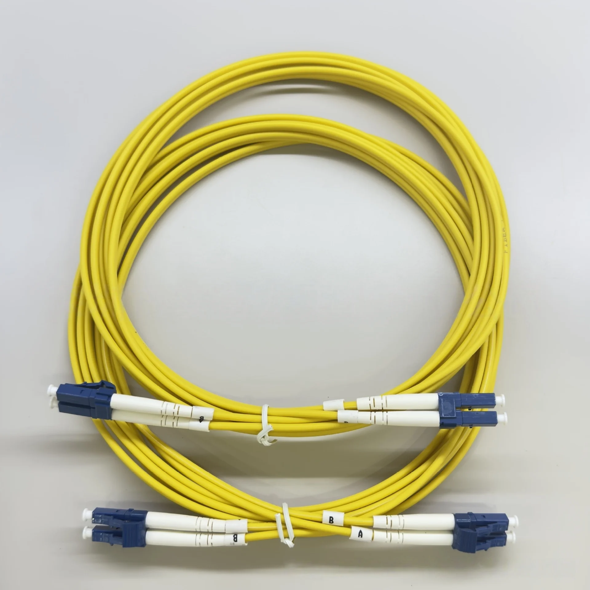 1PC SM Duplex LC UPC to LC UPC Fiber Optical Cable LC UPC Fiber Optic Cable G652D Yellow 2.0mm 0.3dB Fiber Optic Patch Cord