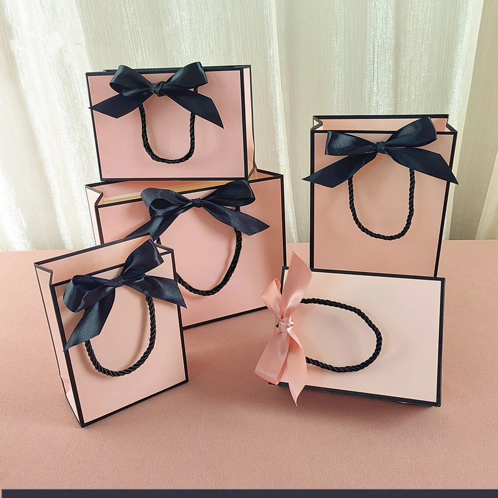 New High Quality Pretty Pink Gift Bag Gift Box Ornament Pajama Book Black Handle With Ribbon Paper Box Bag Kraft Packaging