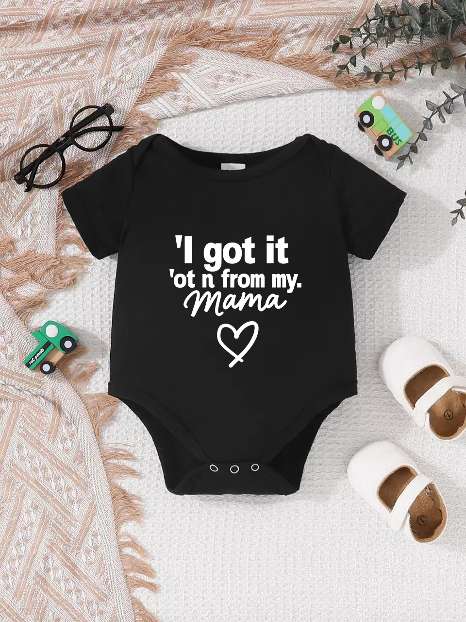 

Playful letter-printed baby short-sleeve triangle bodysuit. Button closure for easy dressing