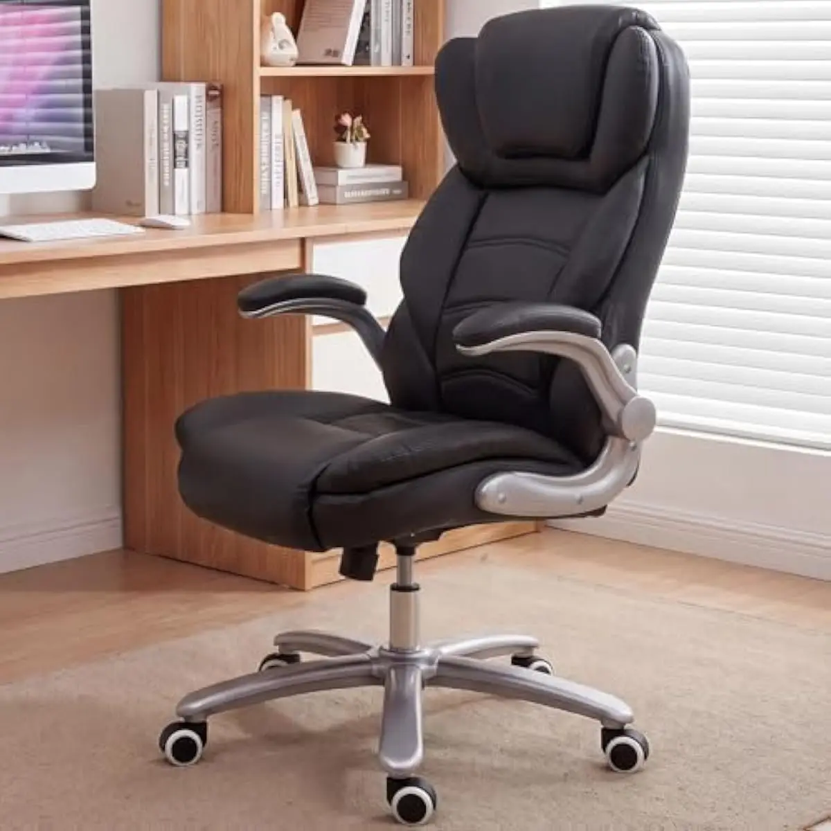 Extra-large executive office chair with premium faux leather upholstery, 400 lb weight capacity, high-back support, flip-up padd