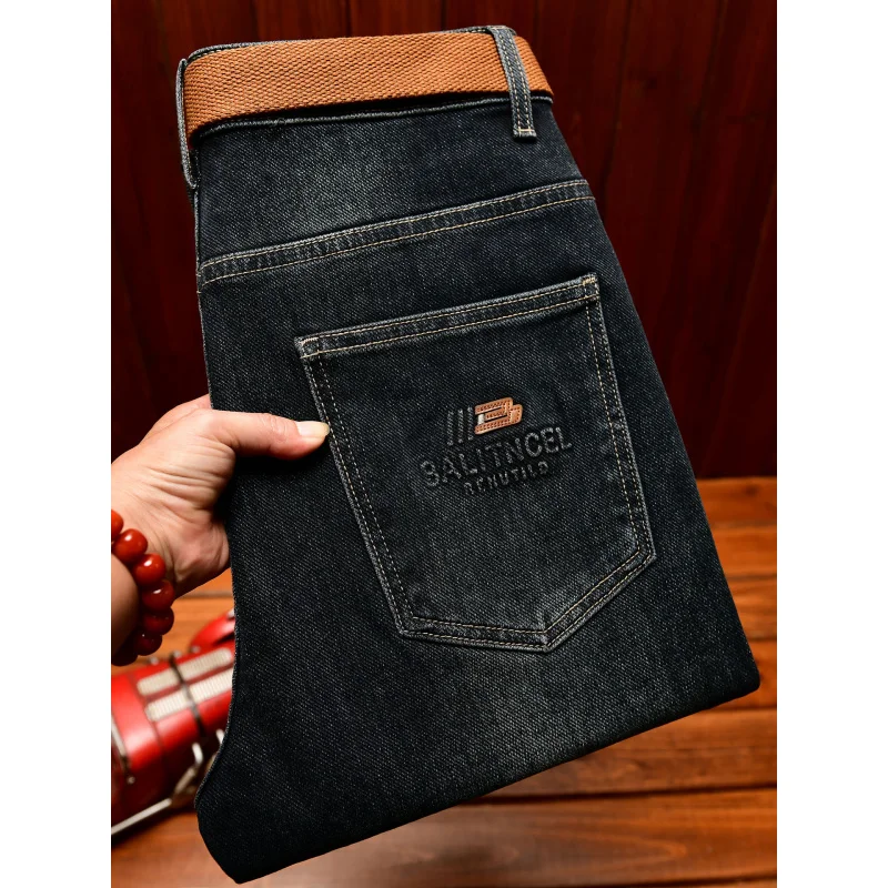 الخريف الراقية الجينز الرجال تصميم الأزياء نسخة ضئيلة صالح مع أقدام صغيرة 2025 الاتجاه الجديد النسخة الكورية السراويل المرنة