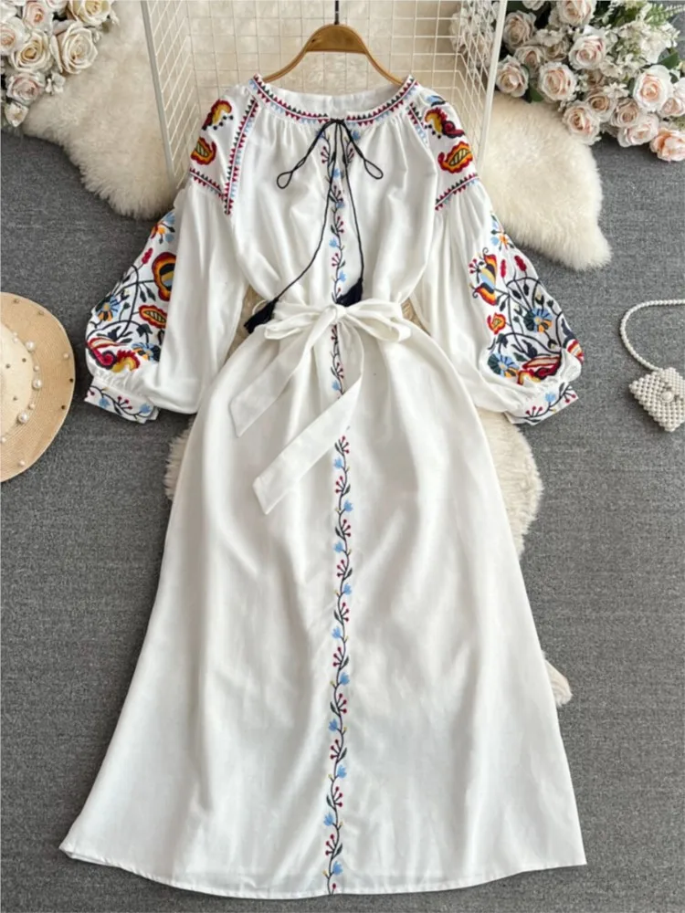 

Elegant long cotton and linen dress with ethnic style lanterns sleeves embroidered round collars a cinched waist