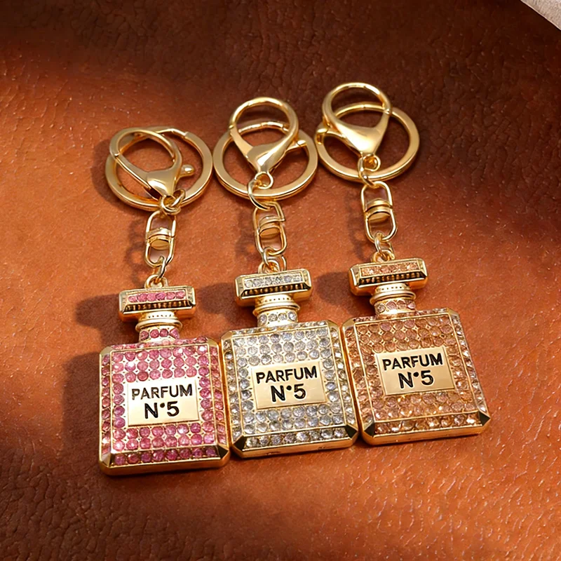 ‌ Llavero con dije de botella de perfume de estilo coreano, metal dorado con diamantes rosas, dorados y blancos, para llaves y bolsos, accesorio de regalo ideal
