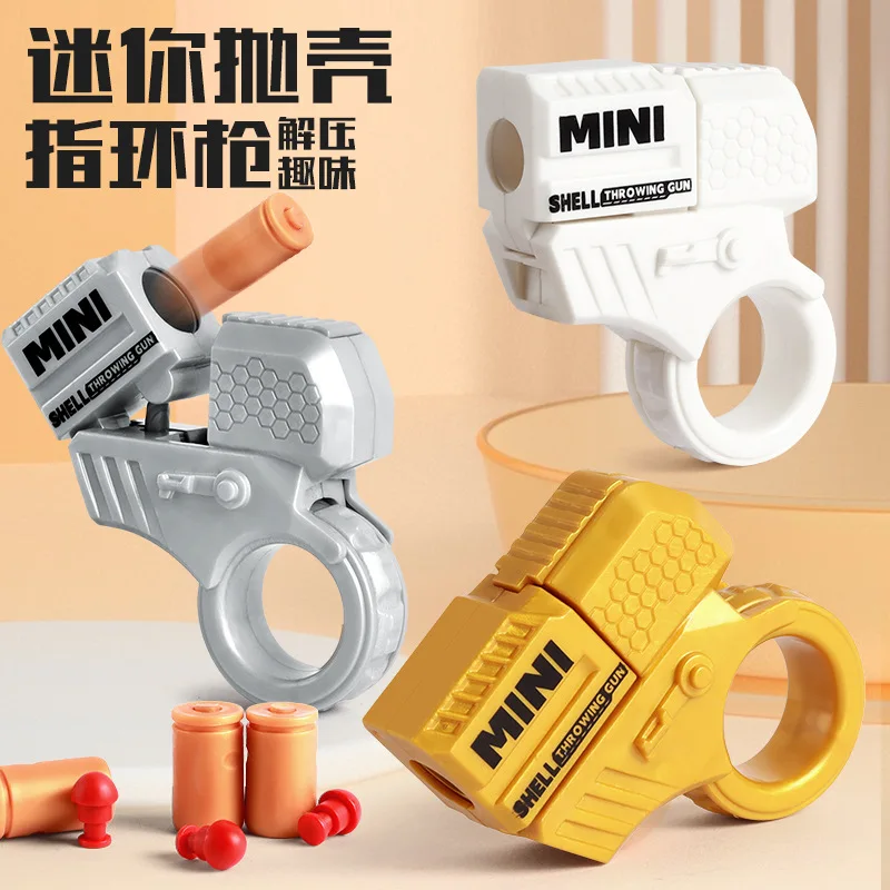 

Cross-border C new mini finger decompression ring cool rotating gun can be fired shell throwing toy boy toy