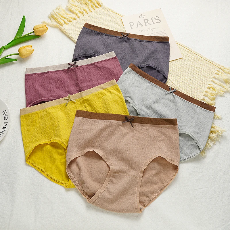 سراويل داخلية نسائية عالية التمدد ذات تغطية كاملة متوسطة الخصر بدون خياطة من مزيج القطن الملون بفيونكة مناسبة لـ 45-65 كجم