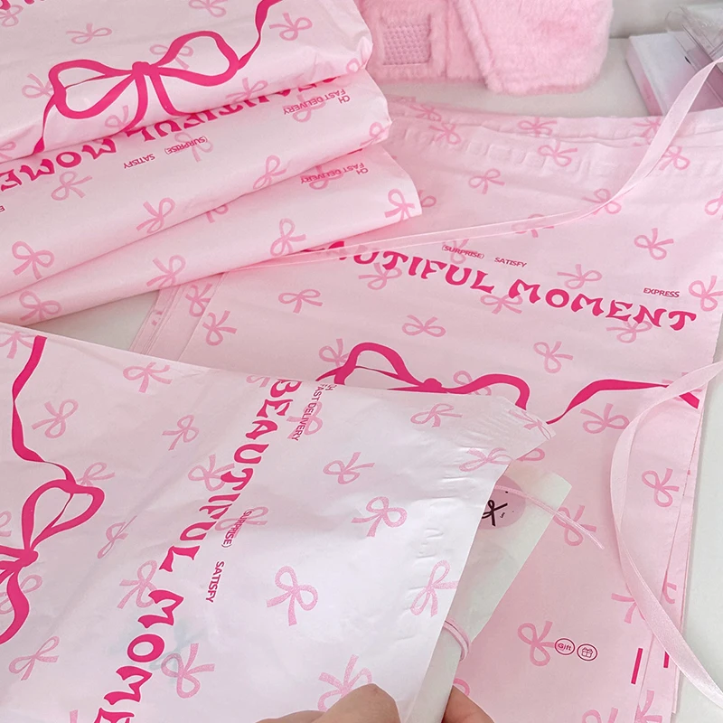 Bolsa de correo Postal de plástico rosa, bolsa de embalaje de almacenamiento de ropa, bolsa de transporte exprés de zapatos de regalo, Impresión de lazo lindo