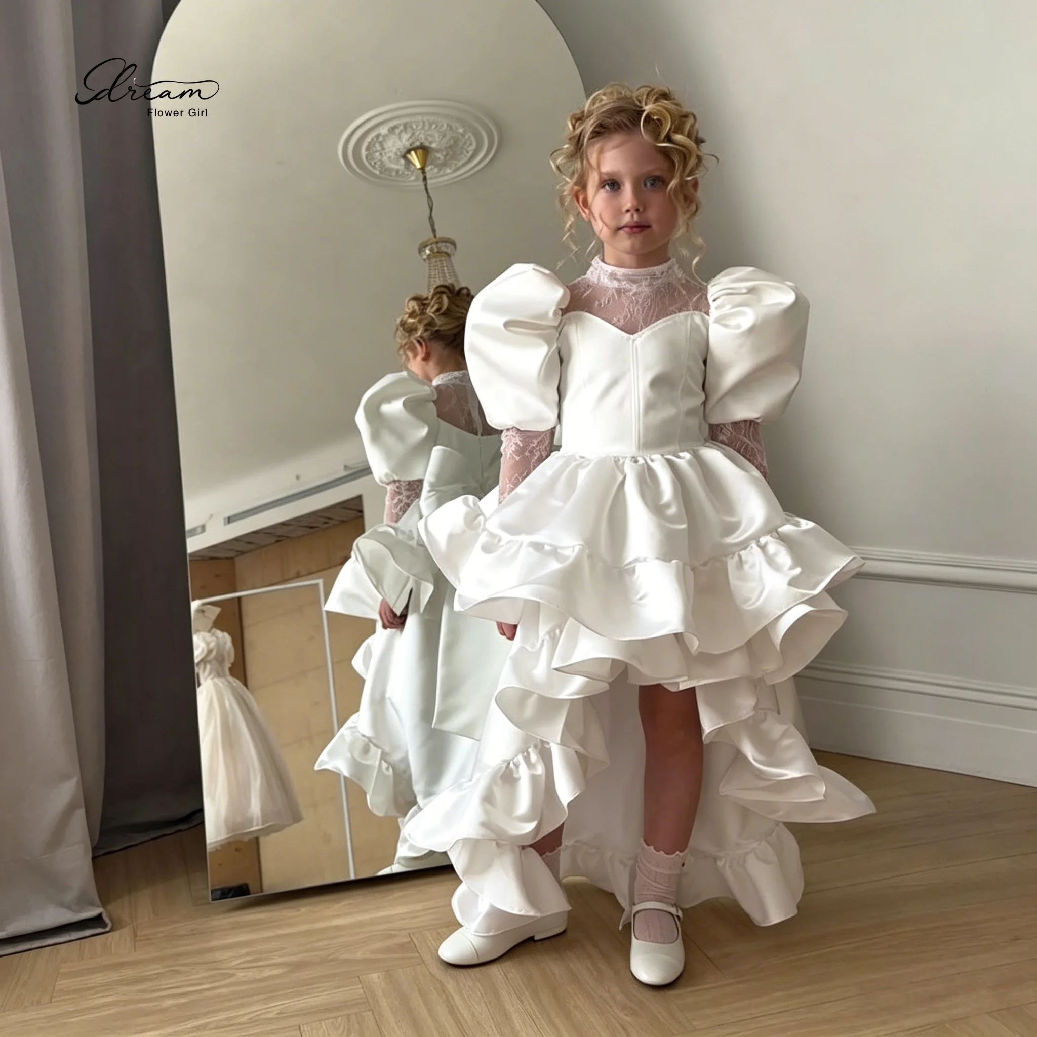 

Floor-length formal gown for girls featuring a white cape-sleeve puffy skirt lace detailing and an asymmetrical hem