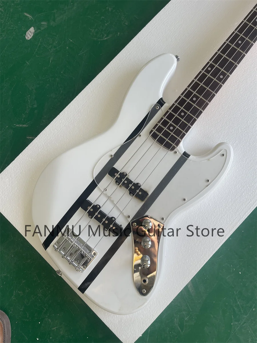 4 string bass, white body, black stripes, yellow maple neck, maple fingerboard, acrylic pickup board