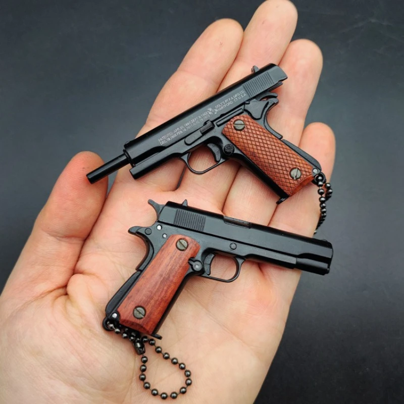

Mini 1911 Pistol Keychain Solid Wood Grip Detachable Ejectable Shell Gun Model, Removable Magazine Slide Action Non-Firing