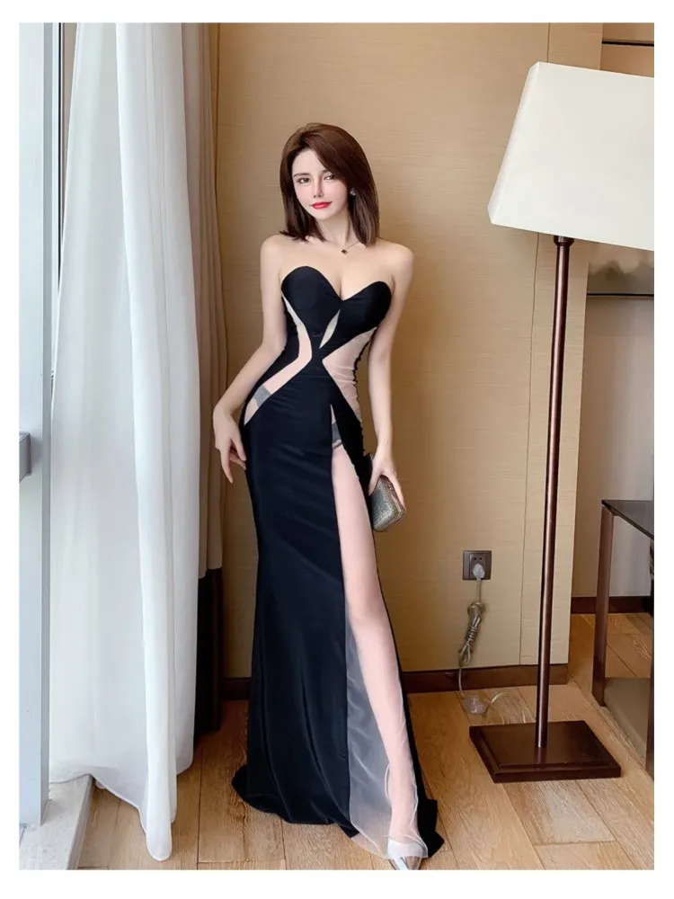

Strapless figure-hugging streamlined and waist-cinching elegant dress