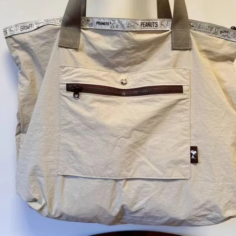 Disney Cute Snoopy Borsa da viaggio per cartoni animati di grande capacità Borsa per bagagli Elegante trolley con maniche Pieghevole portatile Regalo per le vacanze