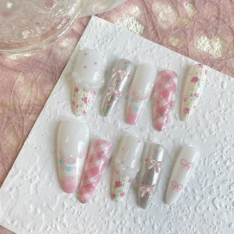 

10 pieces of hand pressed long pointed oval nails, beautiful fake nails, pink and white, cute bow, suitable for women to use