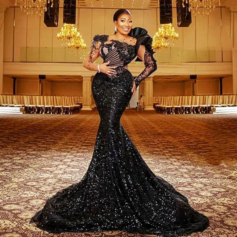 

Sexy Black Lace Evening Dresses African Women Mermaid Sequins Elegant Ruffle Shoulder Seen Through Long Sleeves Party Prom Gowns