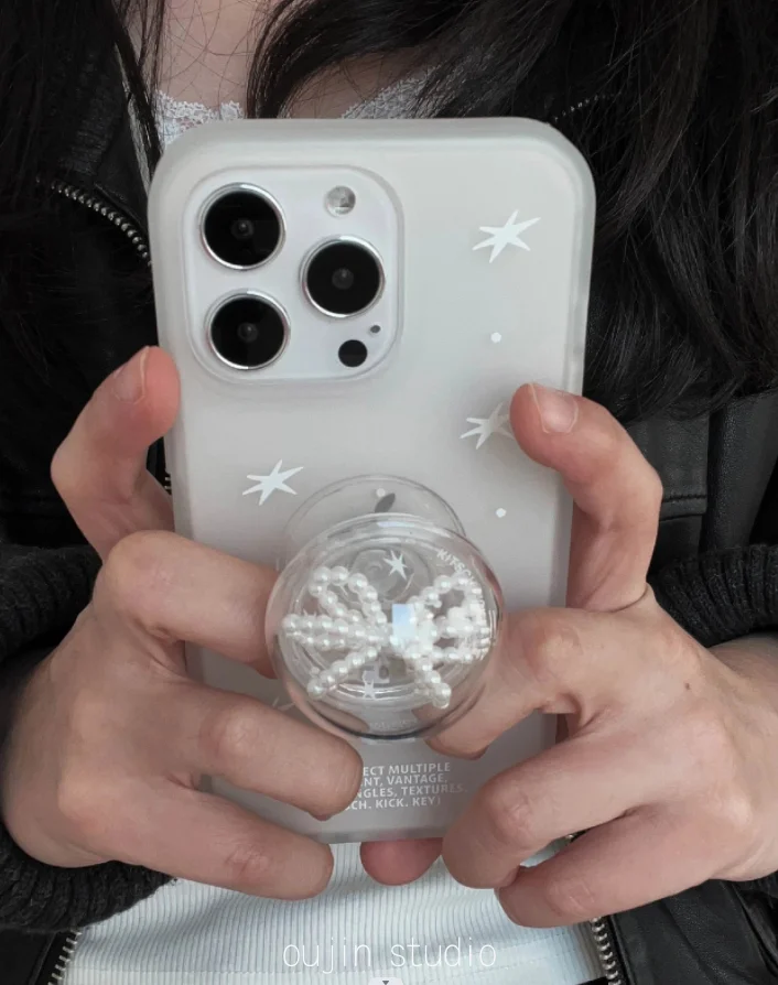 The same Korean Sweet Star print bow airbag phone holder is used for the telescopic desktop of the phone case