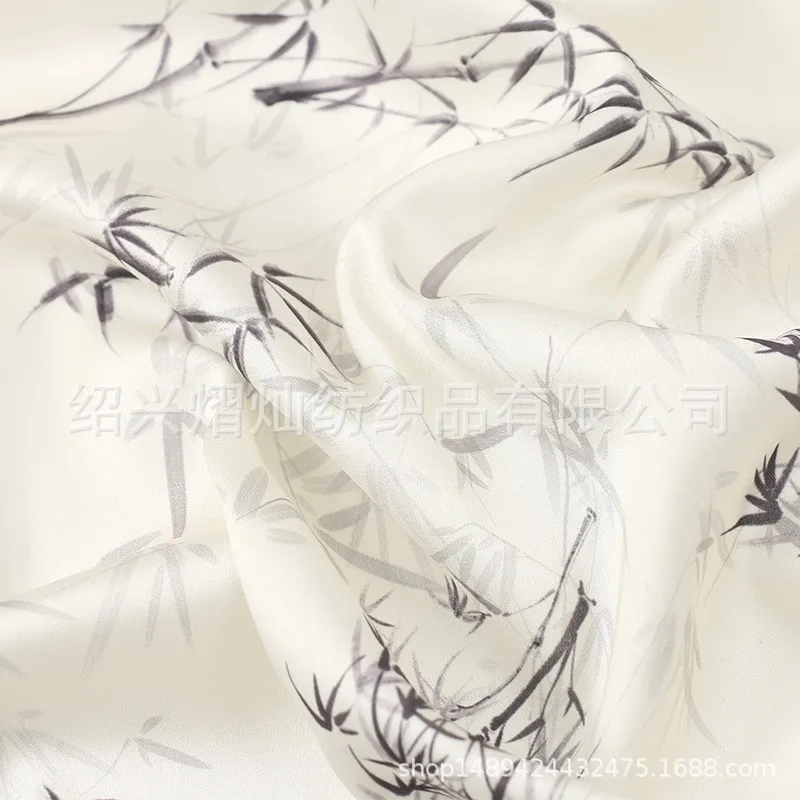 

The fabric of traditional Chinese style Xiangyun satin printed for cheongsam Hanfu and dress is with mountain leaf