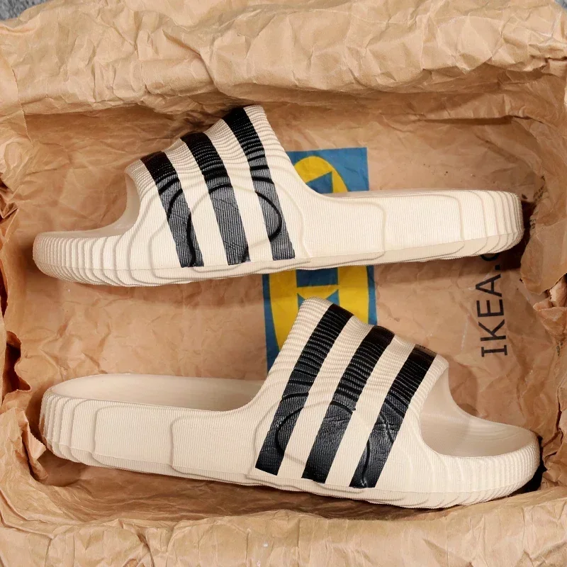 2025 الصيف الرجال موضة نِعال تدليك داخلي/خارجي الصنادل الشاطئ سميكة وحيد الذكور الشرائح الصيف عدم الانزلاق دش النعال